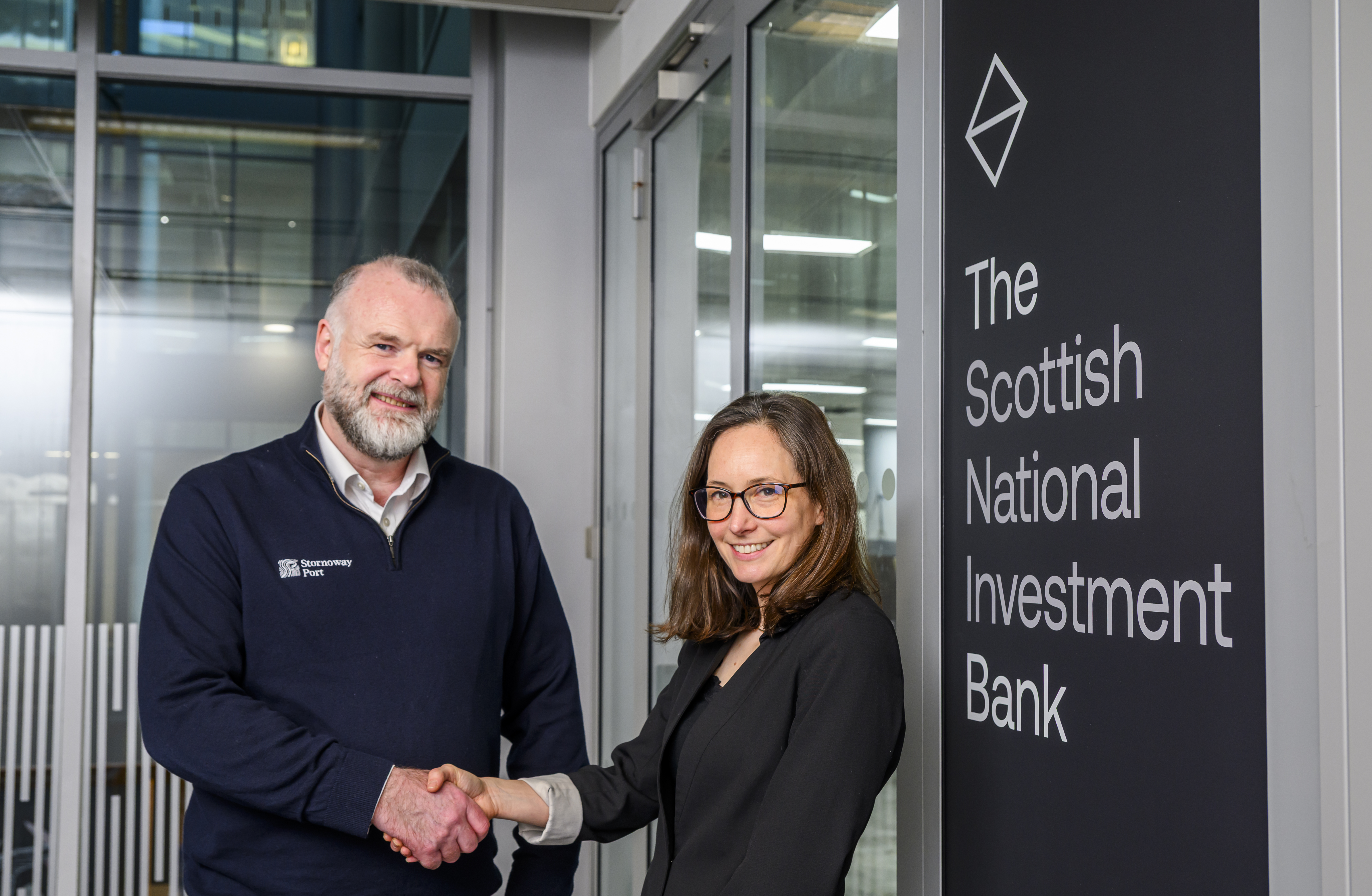 Reps from Stornoway Port and the Bank shaking hands